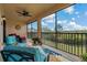 Lanai featuring comfortable seating and serene view of the natural landscape at 23189 Banbury Way # 203, Venice, FL 34293