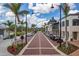 Charming town center features brick-paved streets, palm trees, and stylish buildings with shops and restaurants at 23189 Banbury Way # 203, Venice, FL 34293