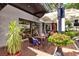 Charming bakery patio with outdoor seating under umbrellas, perfect for relaxing and enjoying treats at 2347 Sunnyside Pl, Sarasota, FL 34239