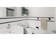 Clean bathroom featuring white fixtures, a modern sink, and a towel rack at 2347 Sunnyside Pl, Sarasota, FL 34239