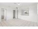 Bright bedroom featuring tile flooring, ample closet space, and neutral paint at 2347 Sunnyside Pl, Sarasota, FL 34239