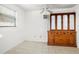 Bedroom featuring tile floors, bright window and a classic ceiling fan at 2347 Sunnyside Pl, Sarasota, FL 34239