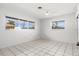 Bright, spacious bedroom with tile floors, large windows, and ample natural light at 2347 Sunnyside Pl, Sarasota, FL 34239