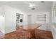 Bright dining room featuring terracotta tile flooring and a large, marble-topped dining table adjacent to the kitchen at 2347 Sunnyside Pl, Sarasota, FL 34239