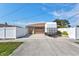 Exterior featuring a two car garage, and a long concrete driveway at 2347 Sunnyside Pl, Sarasota, FL 34239