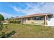 Charming single-story home with manicured landscaping and screened porch at 2347 Sunnyside Pl, Sarasota, FL 34239