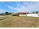 Well-maintained single-story home with lush green lawn and mature landscaping at 2347 Sunnyside Pl, Sarasota, FL 34239