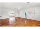 Spacious living room with tile floors, neutral paint, and access to additional rooms in the home at 2347 Sunnyside Pl, Sarasota, FL 34239