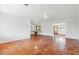Spacious, bright living room featuring tiled floors and ceiling fans at 2347 Sunnyside Pl, Sarasota, FL 34239