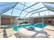 Gorgeous pool and spa, and a covered patio in a backyard setting with screened enclosure at 2347 Sunnyside Pl, Sarasota, FL 34239