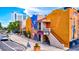 Charming street view featuring a colorful theater and sidewalk adorned with greenery at 2347 Sunnyside Pl, Sarasota, FL 34239