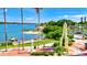 Scenic waterfront park with beach, tropical foliage, and boat access on a sunny day at 2347 Sunnyside Pl, Sarasota, FL 34239
