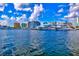 Stunning waterfront view featuring luxury yachts docked in the harbor with city skyline backdrop at 2347 Sunnyside Pl, Sarasota, FL 34239