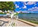Picturesque waterfront view with swan decor and cityscape backdrop under a sunny sky at 2347 Sunnyside Pl, Sarasota, FL 34239
