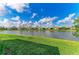 Beautiful lake view from the backyard, showcasing the serene waterfront setting at 2622 Light Sky Ln, Bradenton, FL 34211