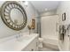 Bathroom features a single sink vanity and tiled shower-tub combination at 2622 Light Sky Ln, Bradenton, FL 34211