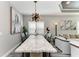 Elegant dining area with a stylish table, modern lighting, and comfortable seating at 2622 Light Sky Ln, Bradenton, FL 34211