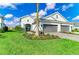 Charming home with a well-manicured lawn, beautiful landscaping, and a two-car garage at 2622 Light Sky Ln, Bradenton, FL 34211