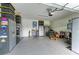 Spacious garage with epoxy floors, cabinets, workbench, and room for two cars at 2622 Light Sky Ln, Bradenton, FL 34211