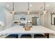Kitchen featuring a large island, stainless steel appliances, and modern pendant lighting at 2622 Light Sky Ln, Bradenton, FL 34211