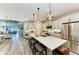 Bright, spacious kitchen featuring a large island, modern appliances, and pendant lighting at 2622 Light Sky Ln, Bradenton, FL 34211