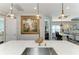 Spacious kitchen with a quartz countertop island and gold fixtures and accents at 2622 Light Sky Ln, Bradenton, FL 34211