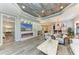 Open living room features fireplace, built-in shelving, access to dining room, and recessed lighting at 2622 Light Sky Ln, Bradenton, FL 34211