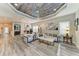 Open floor plan living room and dining room with recessed lighting, natural light, and access to backyard at 2622 Light Sky Ln, Bradenton, FL 34211
