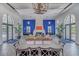 Spacious lounge with a cozy fireplace, comfortable seating, and elegant decor perfect for relaxation and socializing at 2622 Light Sky Ln, Bradenton, FL 34211