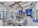 Bright lounge area featuring an elegant fireplace, herringbone floors, high ceilings, and lots of natural light at 2622 Light Sky Ln, Bradenton, FL 34211