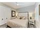 Bright main bedroom with a large bed, modern ceiling fan and light gray walls at 2622 Light Sky Ln, Bradenton, FL 34211