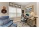 Cozy office with desk, chair, and window with plantation shutters at 2622 Light Sky Ln, Bradenton, FL 34211