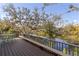 Outdoor deck overlooking water, complete with bench seating and a table at 27350 San Carlos Dr, Punta Gorda, FL 33983