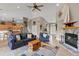 Open-concept living room showcasing a stone fireplace and comfortable furnishings at 27350 San Carlos Dr, Punta Gorda, FL 33983