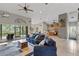 Spacious living room featuring high ceilings, tile floors, and comfortable seating at 27350 San Carlos Dr, Punta Gorda, FL 33983