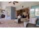 Covered patio with brick floors and outdoor furniture that faces an open doorway at 27350 San Carlos Dr, Punta Gorda, FL 33983