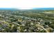 Beautiful aerial view of the neighborhood showcasing the property's location near the water and lush greenery at 2760 Siesta Dr, Venice, FL 34293