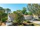 Charming single-Gathering home featuring well-maintained landscaping, attached garage, and outdoor seating at 2760 Siesta Dr, Venice, FL 34293