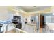 Open kitchen showcasing stainless steel appliances, white cabinetry and a wooden butcher block island at 2760 Siesta Dr, Venice, FL 34293