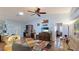 Cozy living room featuring hardwood floors, comfortable furniture, and a view into adjacent rooms at 2760 Siesta Dr, Venice, FL 34293
