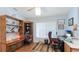 Functional home office with a built-in desk, comfortable chair, and ample storage space at 2760 Siesta Dr, Venice, FL 34293