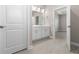 The bathroom features a double sink vanity with white cabinets and a large mirror at 3166 Cabo St, North Port, FL 34291