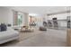 Inviting living space with modern furniture, a view of the dining area, and a bright kitchen at 3166 Cabo St, North Port, FL 34291