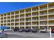 Multi-story condo building featuring balconies, parking, and well-kept grounds at 3656 Lake Bayshore Dr # 319 Bldg K, Bradenton, FL 34205