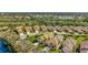 Lakeside community featuring single-Gathering homes with manicured lawns, mature landscaping, and access to community amenities at 3872 Mira Lago Dr, Sarasota, FL 34238
