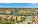 An aerial shot of homes in a lakeside community with mature landscaping and easy access to neighborhood streets at 3872 Mira Lago Dr, Sarasota, FL 34238