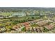 Overhead shot of single-Gathering homes close to a golf course and other amenities in a well-maintained community at 3872 Mira Lago Dr, Sarasota, FL 34238