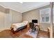 Neutral bedroom with hardwood floors, a desk and abundant natural light at 3872 Mira Lago Dr, Sarasota, FL 34238