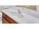 Bathroom featuring an undermount sink, single faucet, quartz countertops and wood cabinets at 4307 70Th E Ave, Ellenton, FL 34222