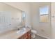Well-ventilated bathroom with single sink, a large mirror, and a window providing natural light at 4307 70Th E Ave, Ellenton, FL 34222